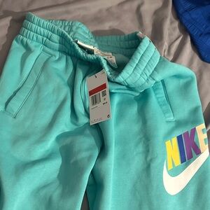 Nike Kids Turquoise Joggers with Colorful Logo